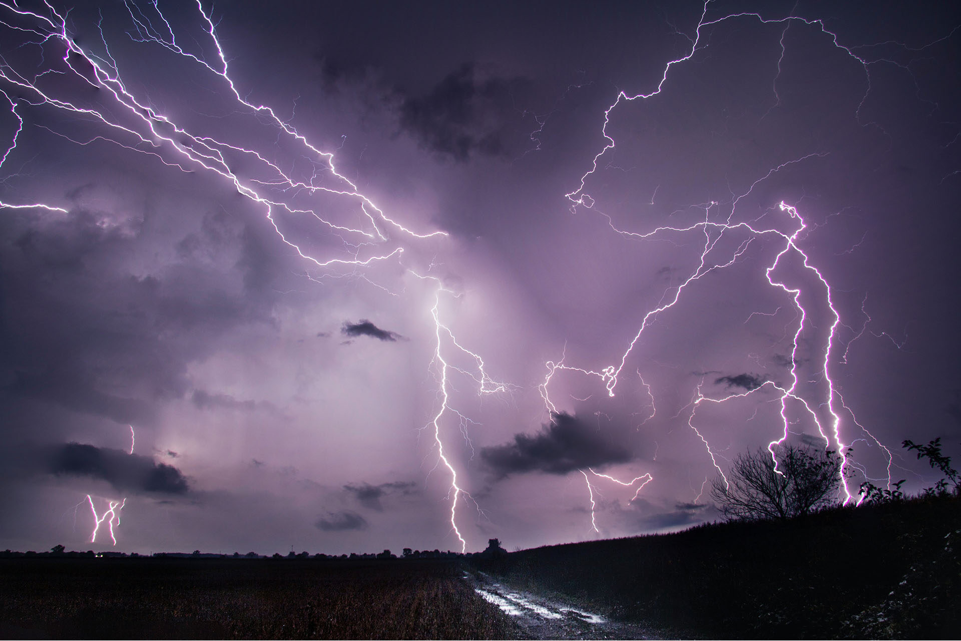 A cloudy night sky filled with lightning