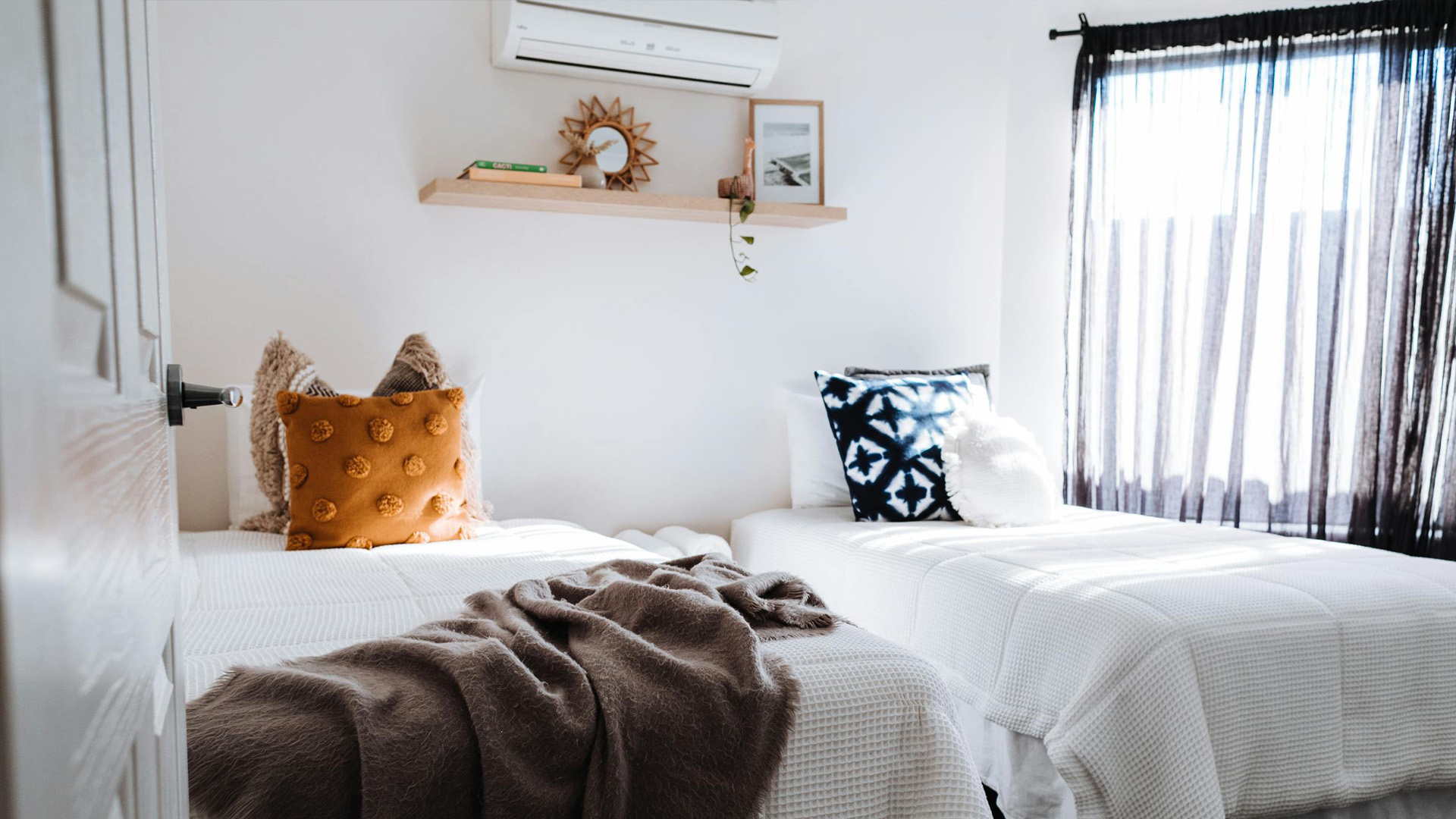 A cool bedroom kept comfortable and purified with a mini-split unit